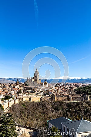 Segovia, Spain â€“ View of the Cathedral and the Sierra the Guadarrama behind in Winter Stock Photo